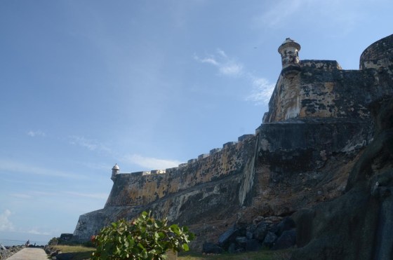 Looking up at the massive walls of El Morro.