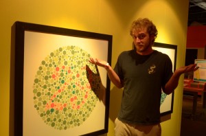 He's color blind...the shrug says it all.  He can't see that number.  Can you?