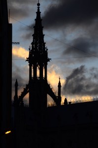 Evening shot of the tower of the Basilica silhouetted against a stormy sky